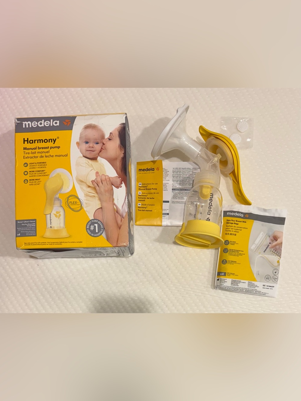 Medela Manual Breast Pump with Yellow and White Accents